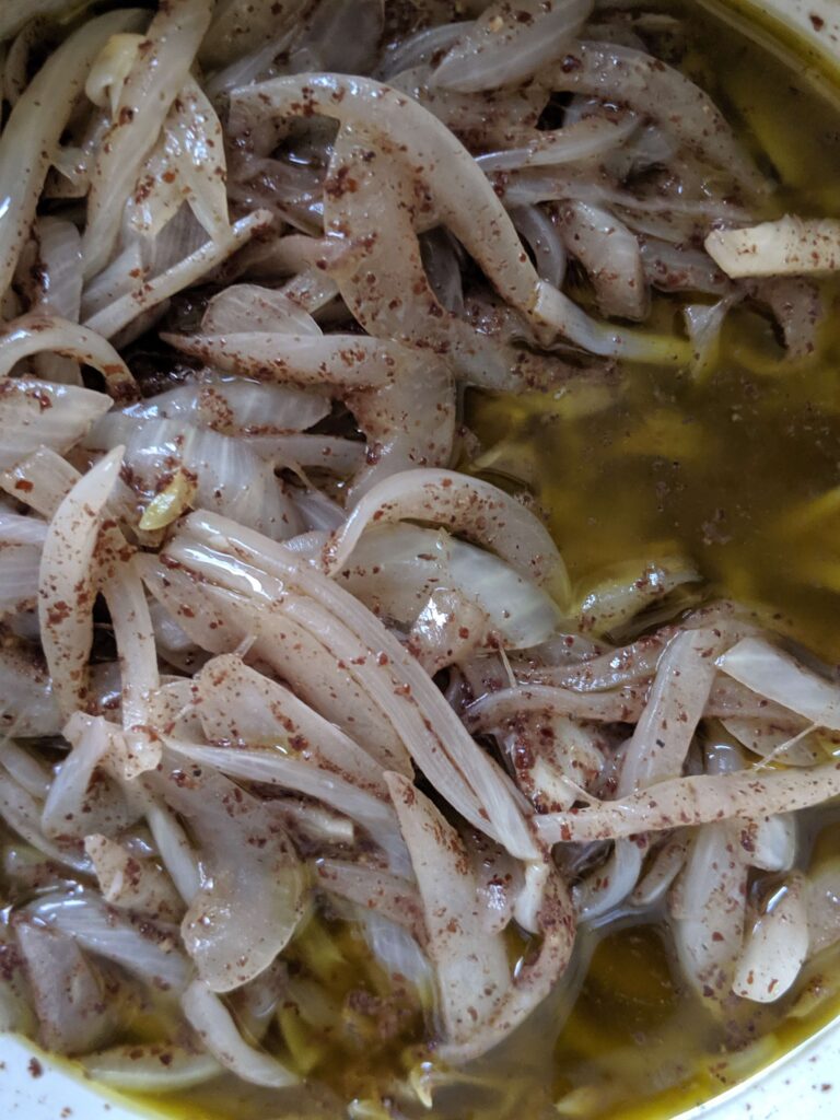 onions cooked with sumac and olive oil