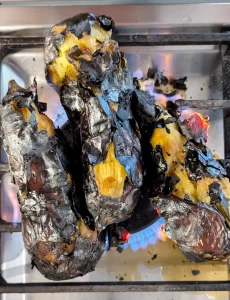 eggplant charred over gas stove