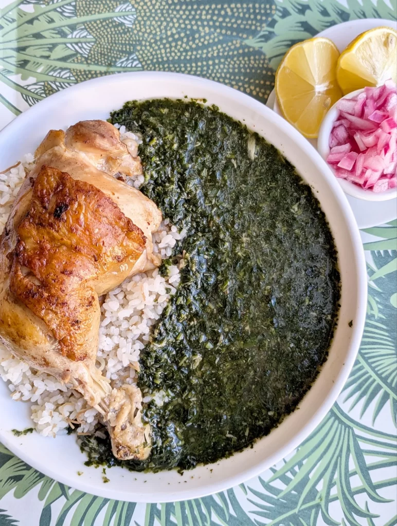 molokhia with Egyptian rice, chicken, and pickled onions