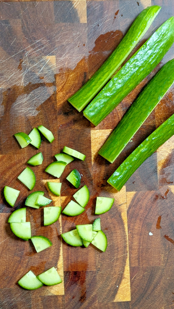 Chopping cucumber for cucumber and yogurt salad